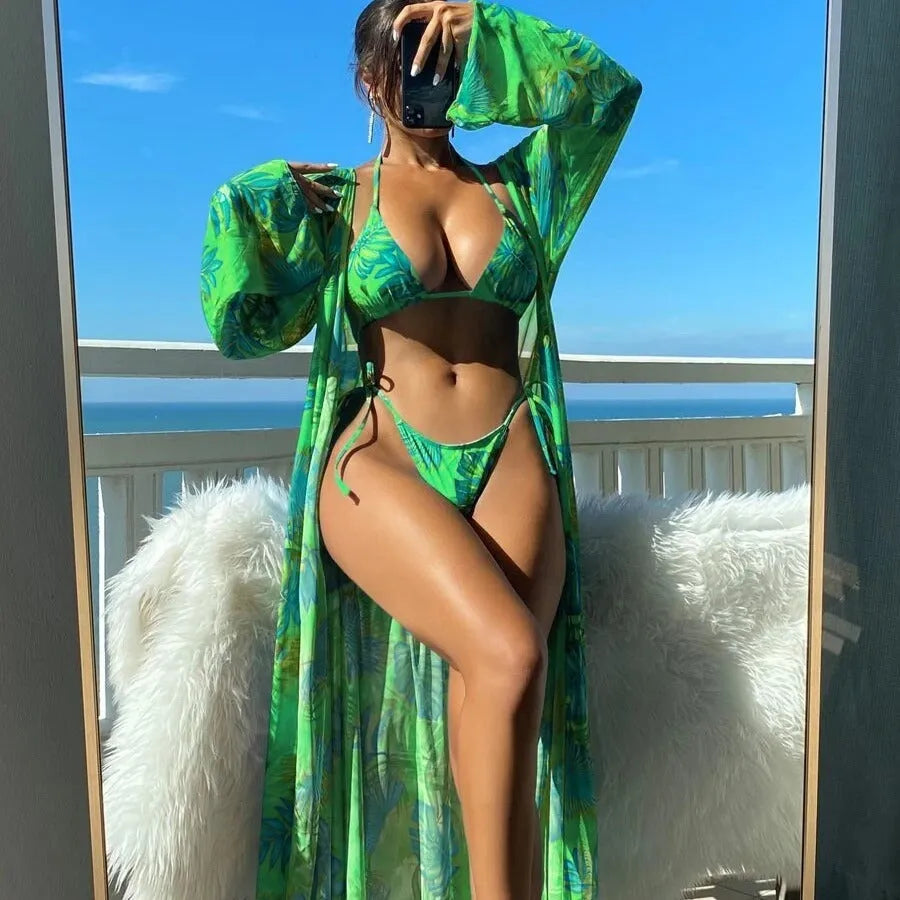 Women's long sleeve floral swimsuit bikini set with matching robe.