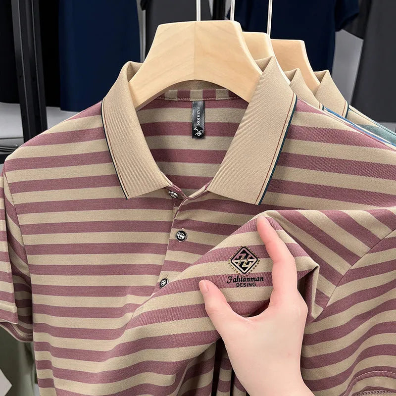 Man wearing a red and blue striped short sleeve casual shirt with a mosaic pattern.