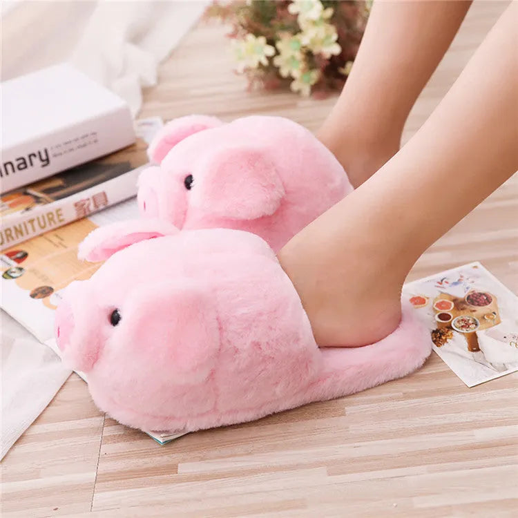 Pink pig-shaped floor slippers made of short plush material.