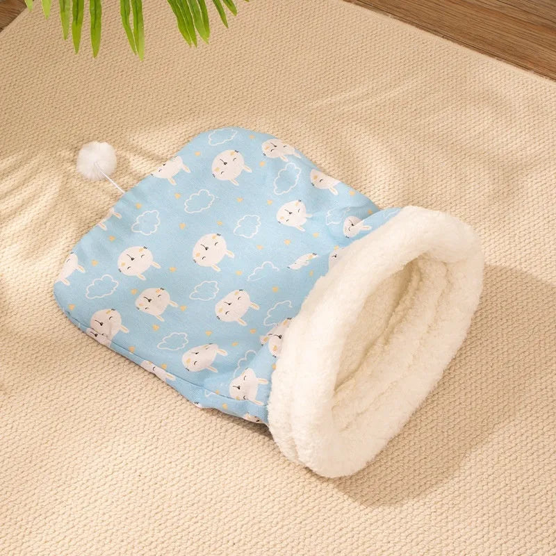 Flannel cat sleeping bag nest in pink Trojan design, showing cosy enclosed bed for pets.