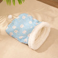 Flannel cat sleeping bag nest in pink Trojan design, showing cosy enclosed bed for pets.