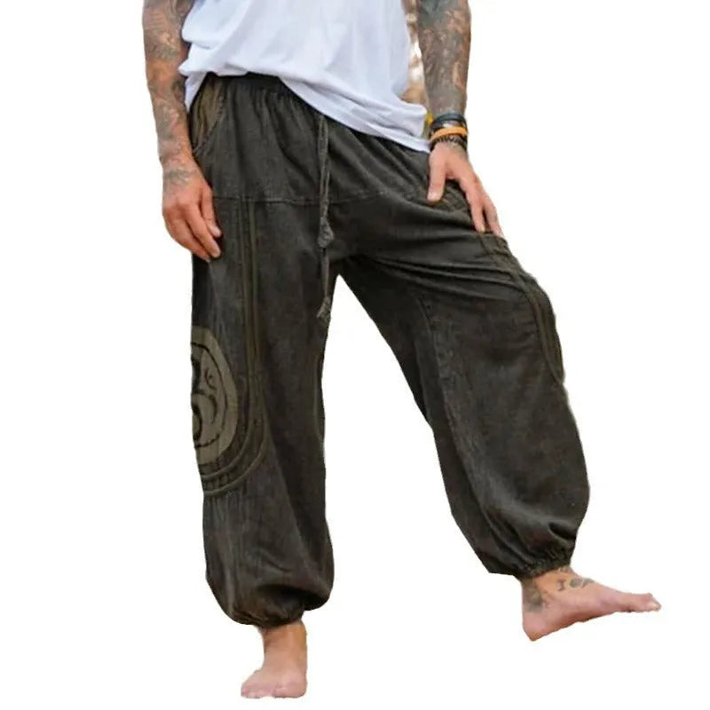 Dark green men's trousers with ethnic pattern and ankle tie detail, mid waist fit