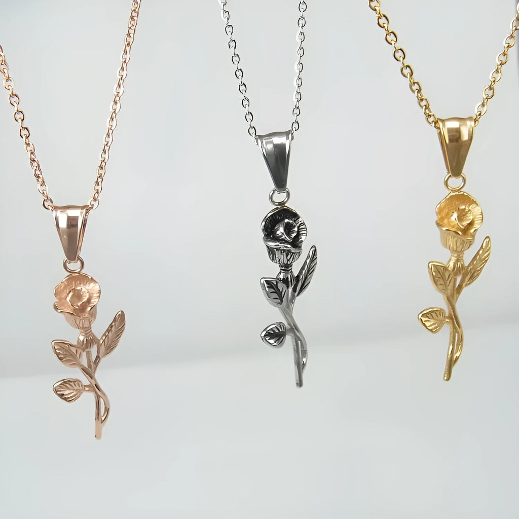 Polished stainless steel men's necklace with cross and rose pendant, gold colour, on display