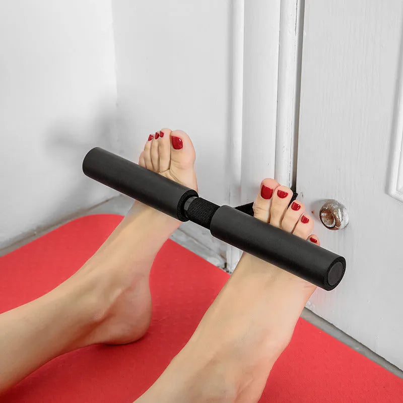 Black abdominal fitness device made from steel foam and PVC tube, 3.1 by 32 by 21.5 centimetres on a flat surface