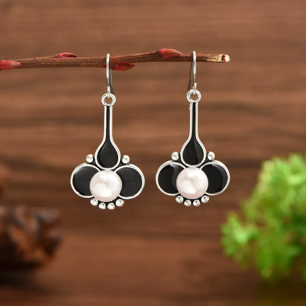 A pair of retro-style creative women's earrings in silver-colour alloy.