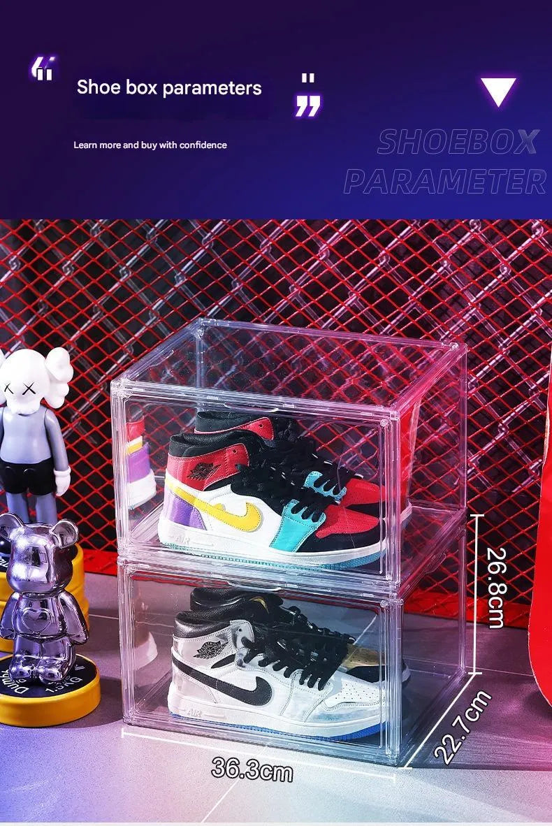 Large clear acrylic shoe storage box with a magnetic side door open, showing shoes inside.