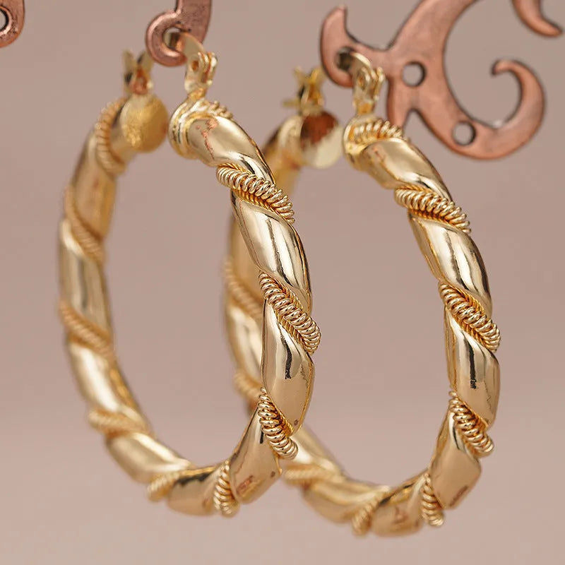 Geometric golden copper earrings with ring and line design elements for women