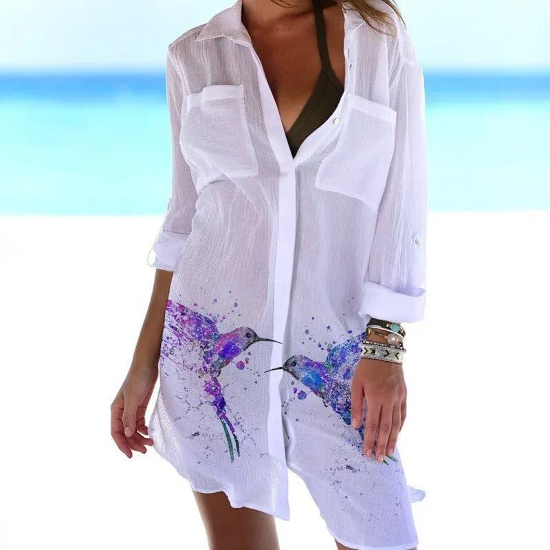 Women's long sleeve polyester cardigan with a colourful 3D bird and flower digital print, shown as a beach cover-up.