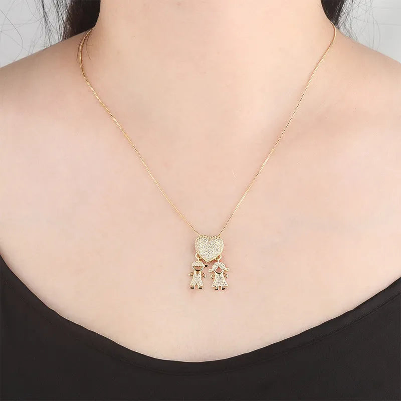 Gold colour copper heart pendant necklace with zircon inlays on white background