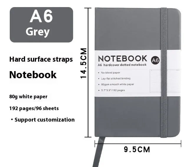 A5 soft touch PU leather strap diary open showing lined pages, closed with elastic band, in a choice of colours.