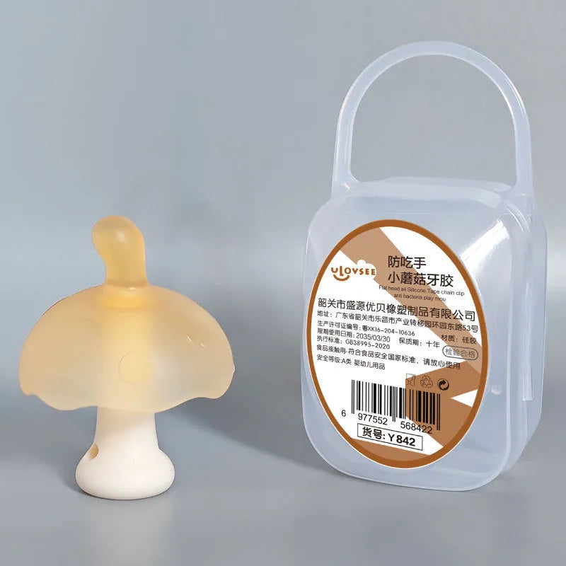 Small mushroom-shaped gum chewy toy in pink or nano colour, shown with transparent display box and optional chain.