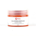 Leather repair cream in a round tin, available in multiple colours including black, blue, and red
