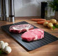 Black aluminium quick defrosting tray for thawing frozen meat without electricity