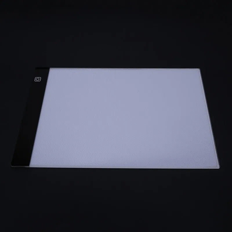 LED artist tracing table with acrylic panel and USB power, showing dimming function on a drawing surface