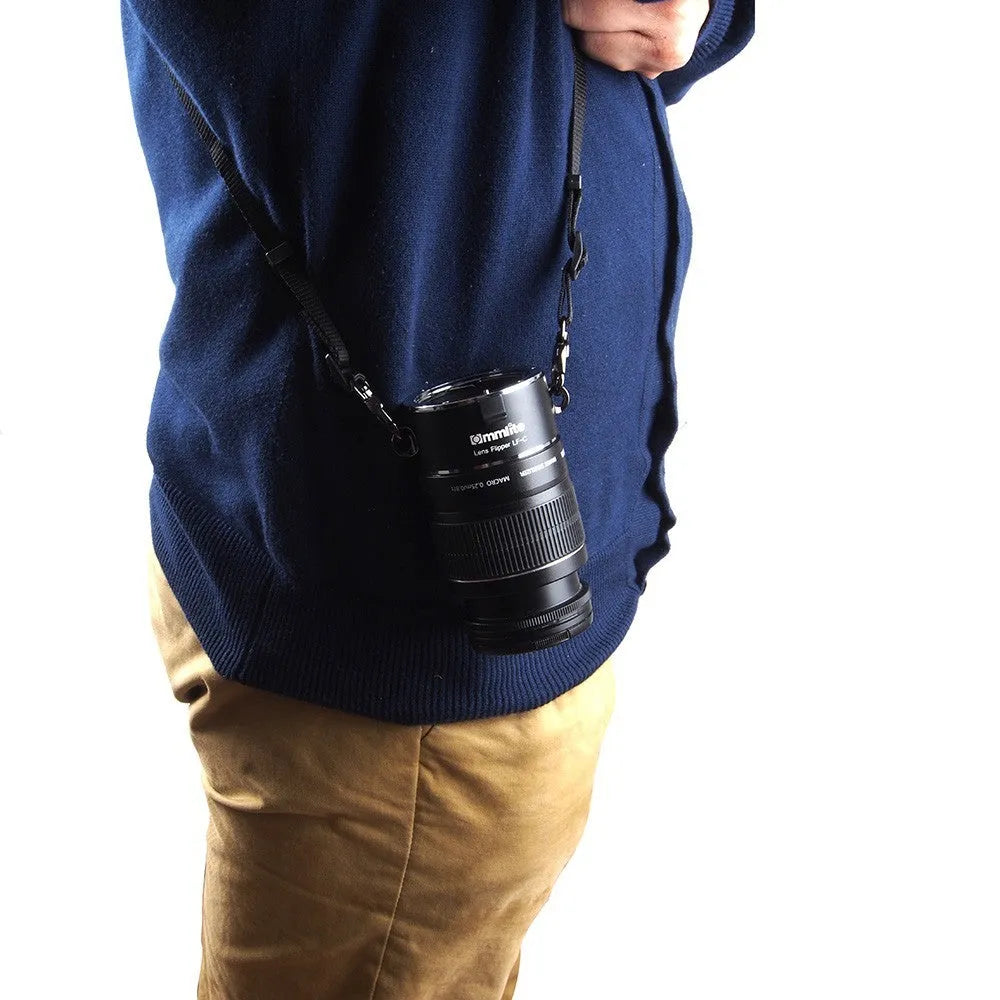 Aluminium camera lens flipper holder with cotton shoulder strap for Canon, Nikon, or Sony cameras.