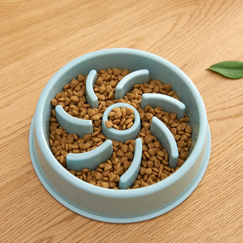 Plastic slow food bowl for dogs and cats with flower-shaped internal obstacles, pink colour, choke prevention design.
