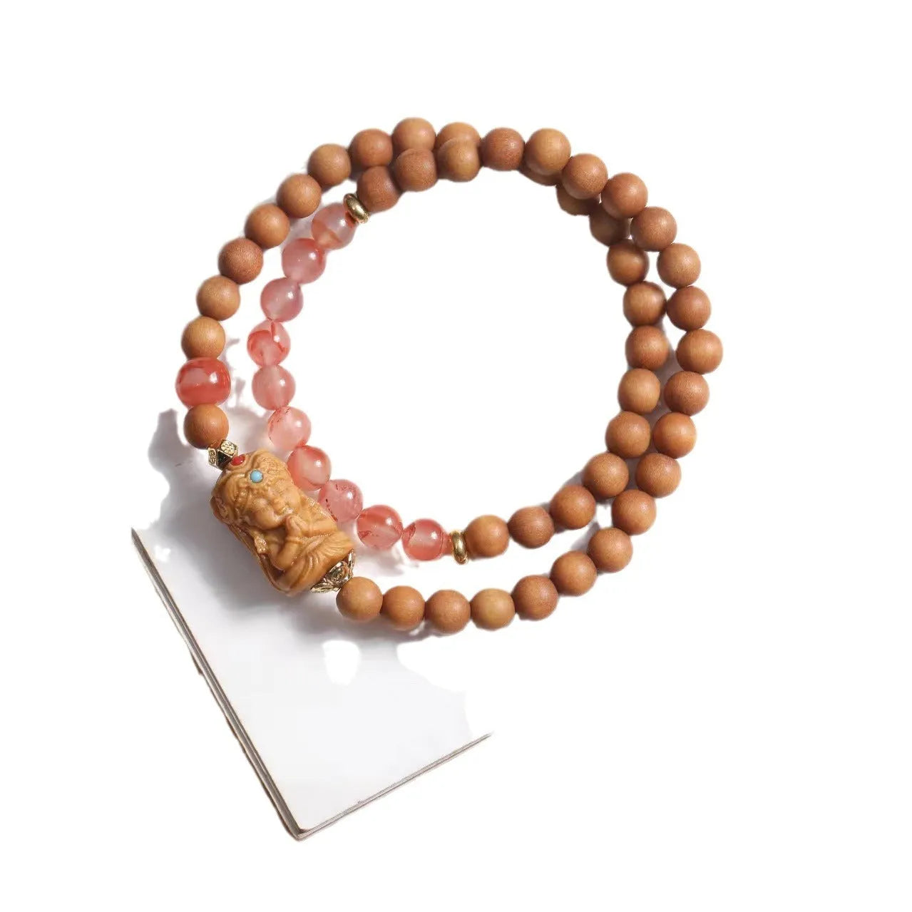 Brown wooden bracelet with 6mm round beads featuring a woven South Red Zachilam double circle design.