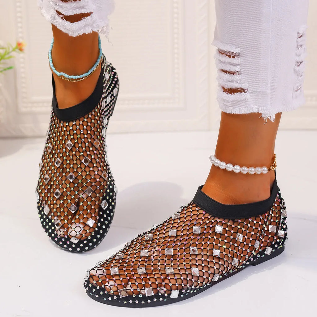 Women's colourful rhinestone mesh flat sandals on white background showing round toe design