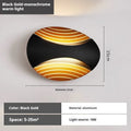 Modern minimalist wall-mounted bedside lamp with touch control in a black gold finish.