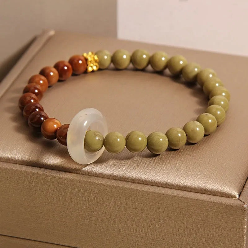 Green gradient Chinese style bracelet with crown and diamond motifs on mixed materials