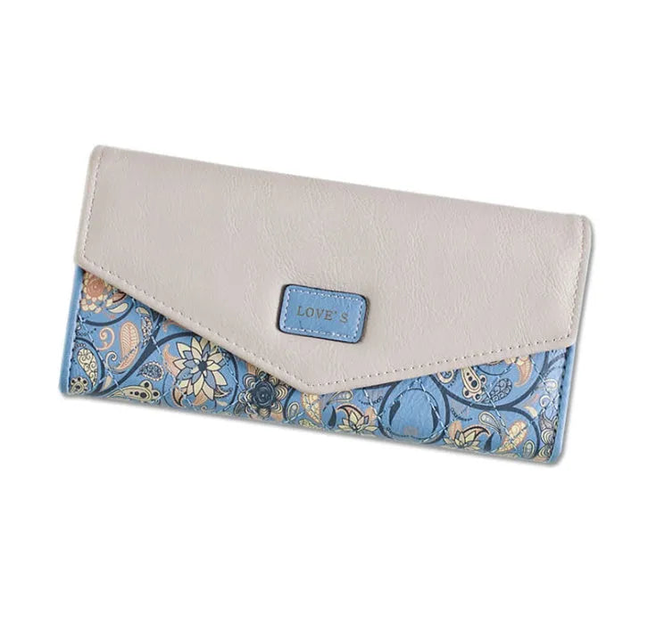 Open three-fold student wallet with buckle closure, shown in colour options on a table.