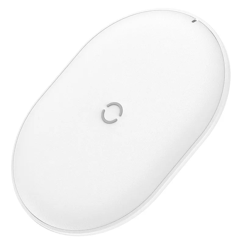Baseus Rough 15W wireless charging pad in black on a desk next to a mobile phone.