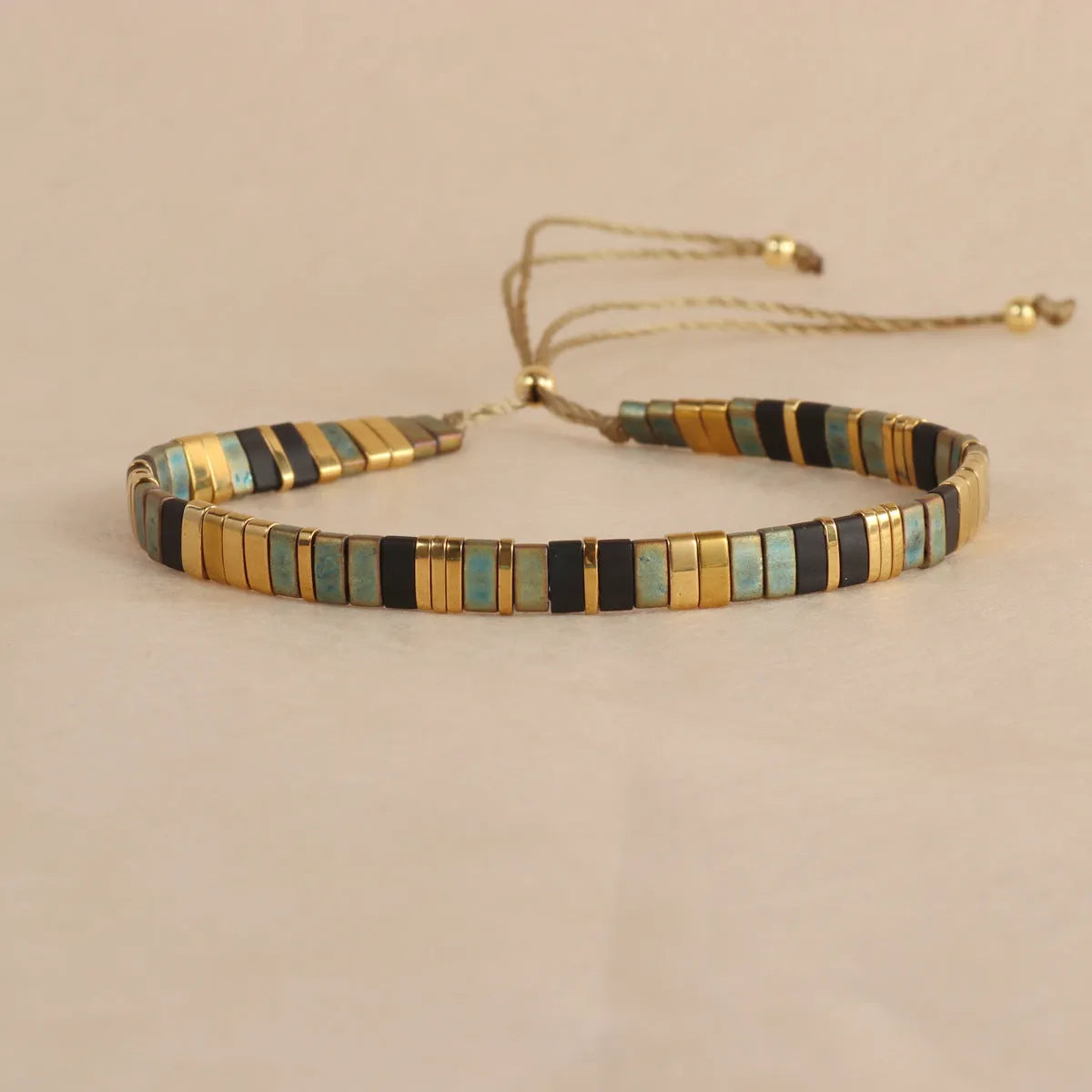Geometric pull bead bracelet with round glass beads in five colour options