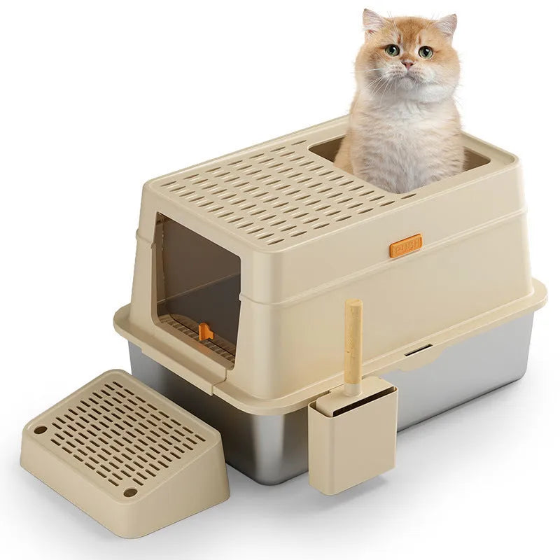 Grey enclosed cat litter box with a foot pedal open, showing the stainless steel dustbin inside.