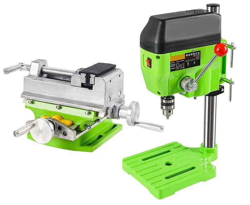 Mini bench drill and milling machine on a workbench with bench pliers.