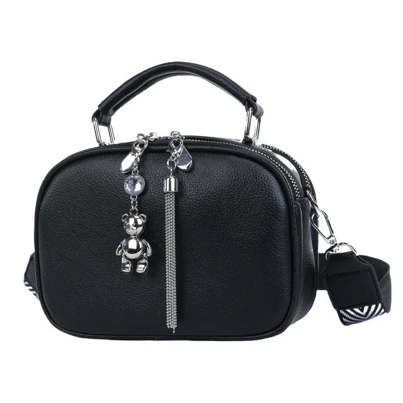 Women's small square stitching bag in PU material showing oval shape and double shoulder straps