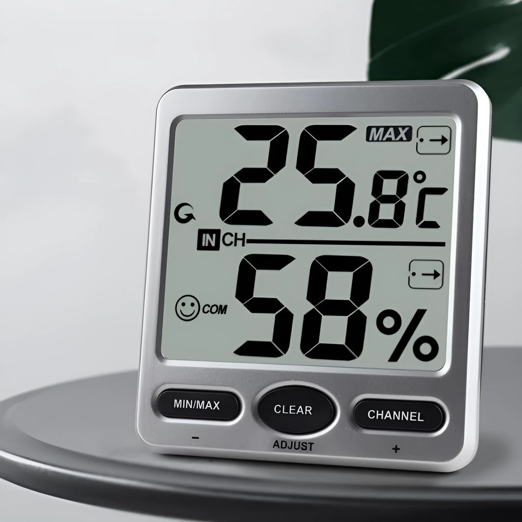 Silver electronic digital thermometer with humidity display for wall mounting in living room or baby room