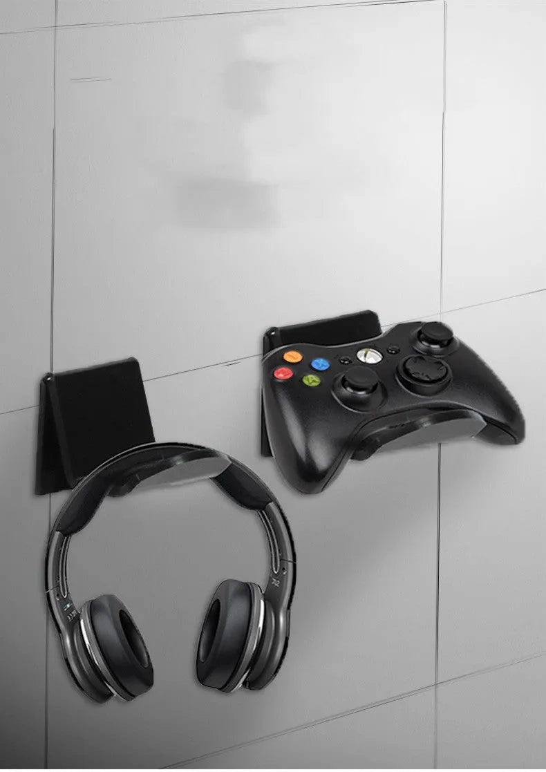 Universal game controller wall mount bracket in black colour shown mounted on wall