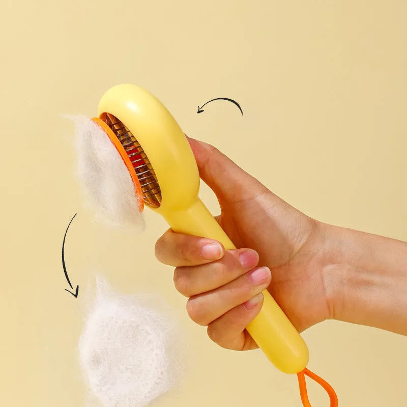 Small yellow duck-shaped pet grooming comb with open section design and needle teeth for cat and dog fur removal