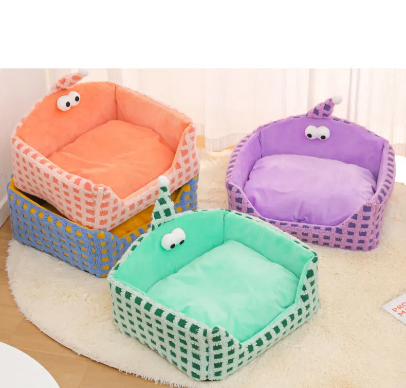 Triangular hat-shaped pet sleeping nest with removable sponge insert in green, purple, and yellow colours