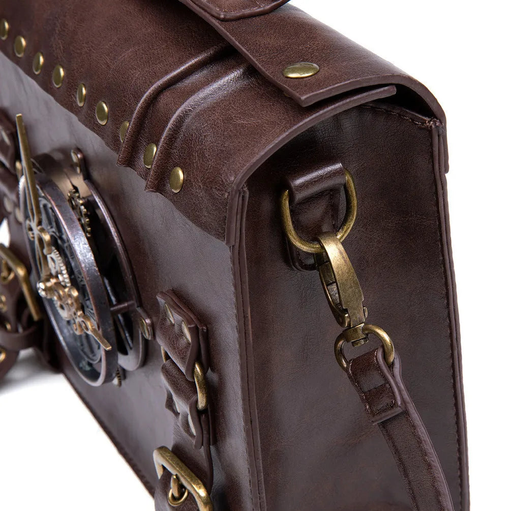 Bronze steampunk style PU leather shoulder bag with metal hardware on a horizontal square pillow bag shape.