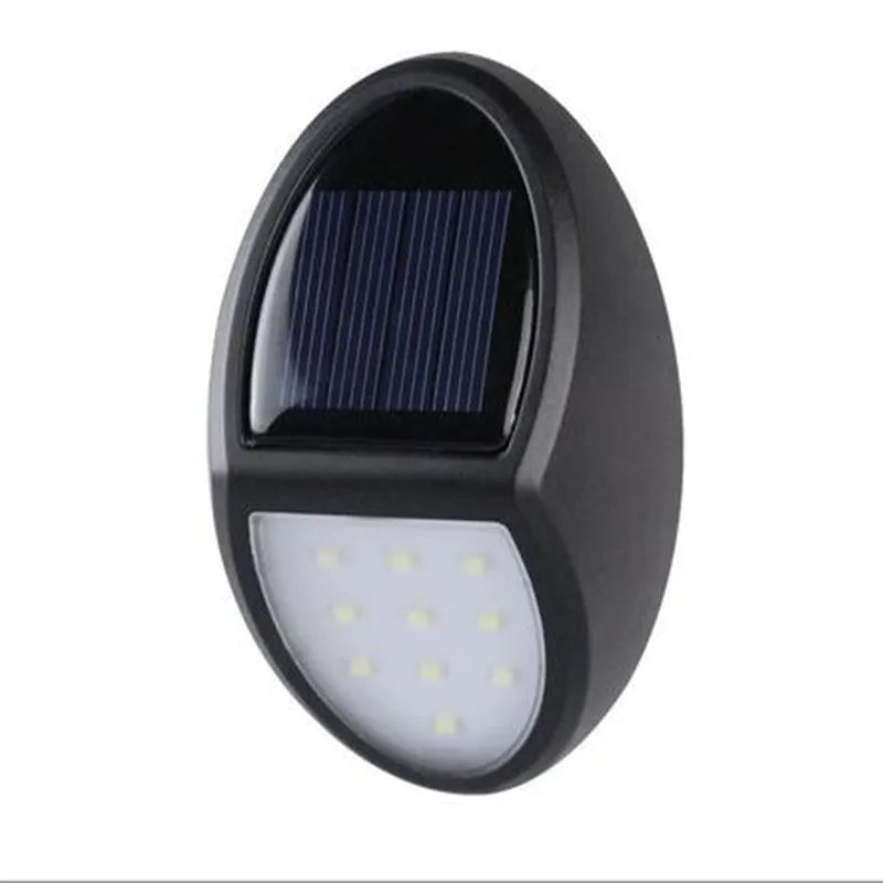 Black rectangular solar-powered LED wall light for outdoor automatic lighting.