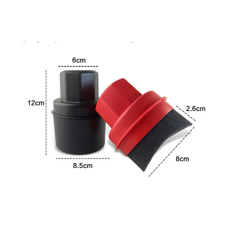 Hand-held black tyre oil sponge brush with lid on a white background.