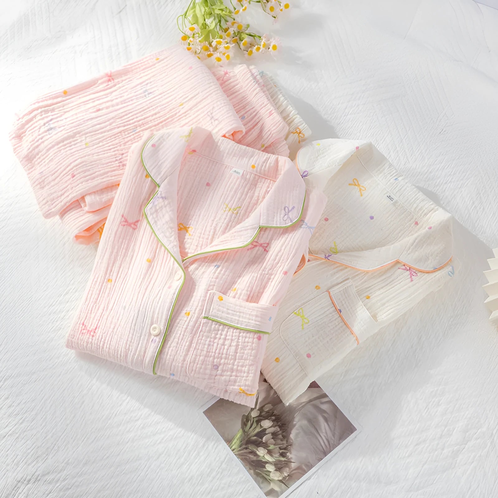 Women's pink cotton pajamas set with long sleeves and trousers on hanger