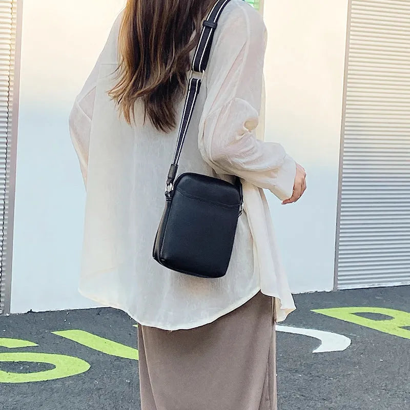 Solid colour small crossbody shoulder bag for mobile phones in beige.