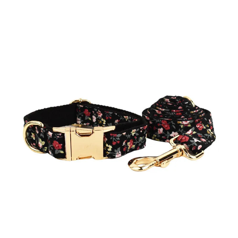 Dog wearing four-piece cloth accessory set with collar, leash, vest, and removable bow with lettering print