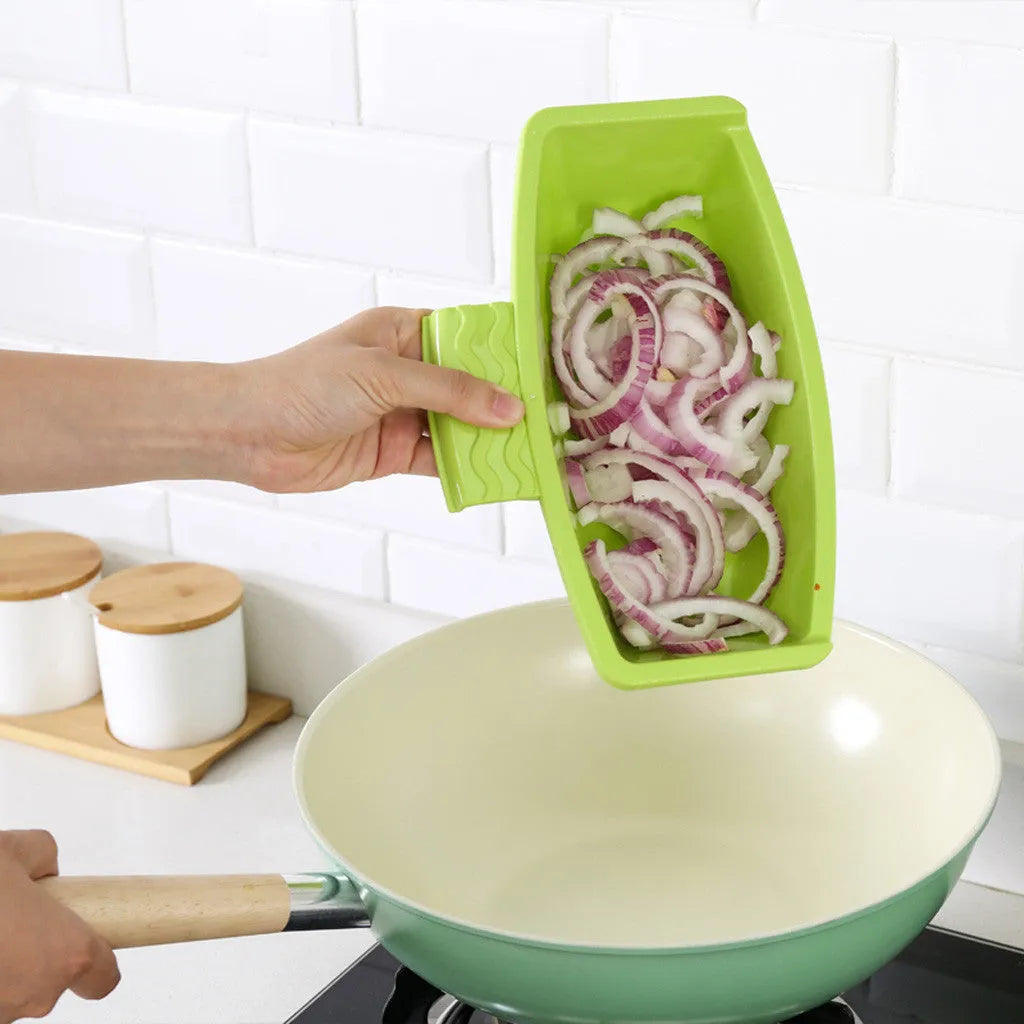 Green multi-function kitchen cutting board with drainage holes mounted on a sink edge