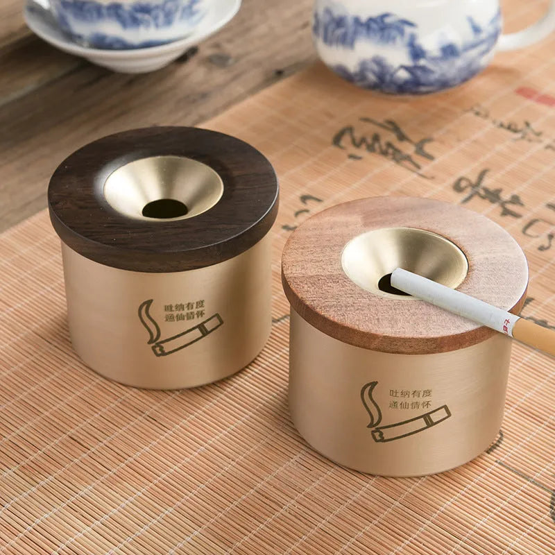 Copper retro ashtray with wooden lid showing central hole for ash collection