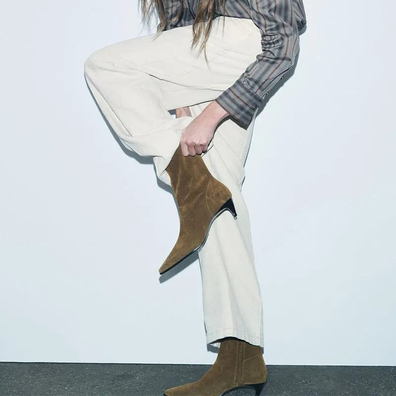 Brown square-toe kitten heel ankle boots with a side zipper on a white background.