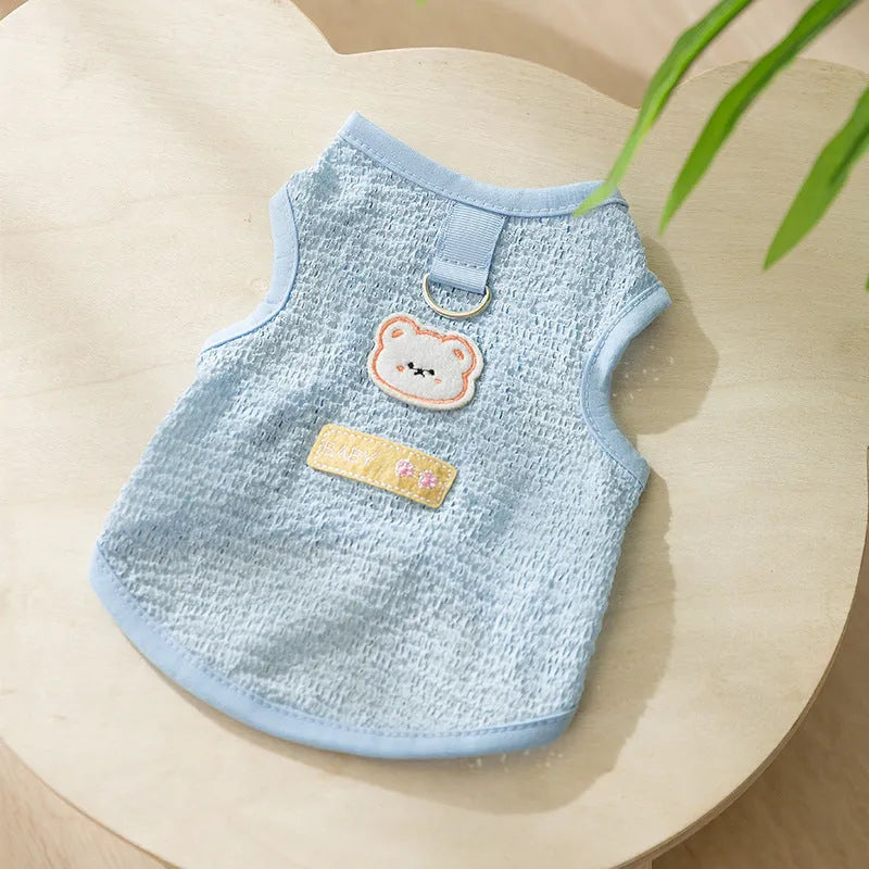Green knitted cat clothes with a hollowed-out bear patch cartoon design.