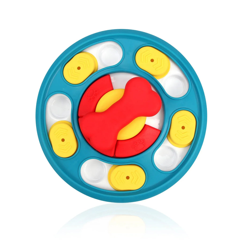 Blue plastic leak-proof feeding puzzle dog toy spinner on floor with kibble