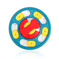 Blue plastic leak-proof feeding puzzle dog toy spinner on floor with kibble