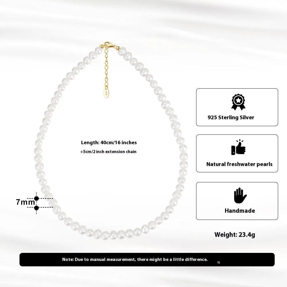 Women's adjustable silver necklace with a strand of natural freshwater pearls.