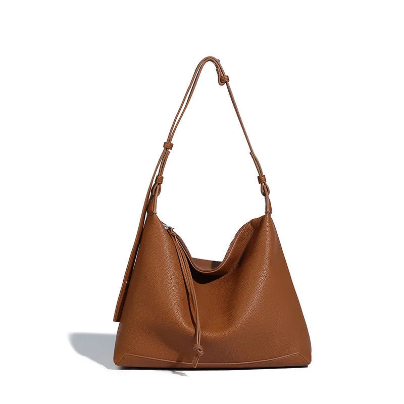 Soft PU messenger bag in caramel colour showing 36cm length and underarm shoulder strap