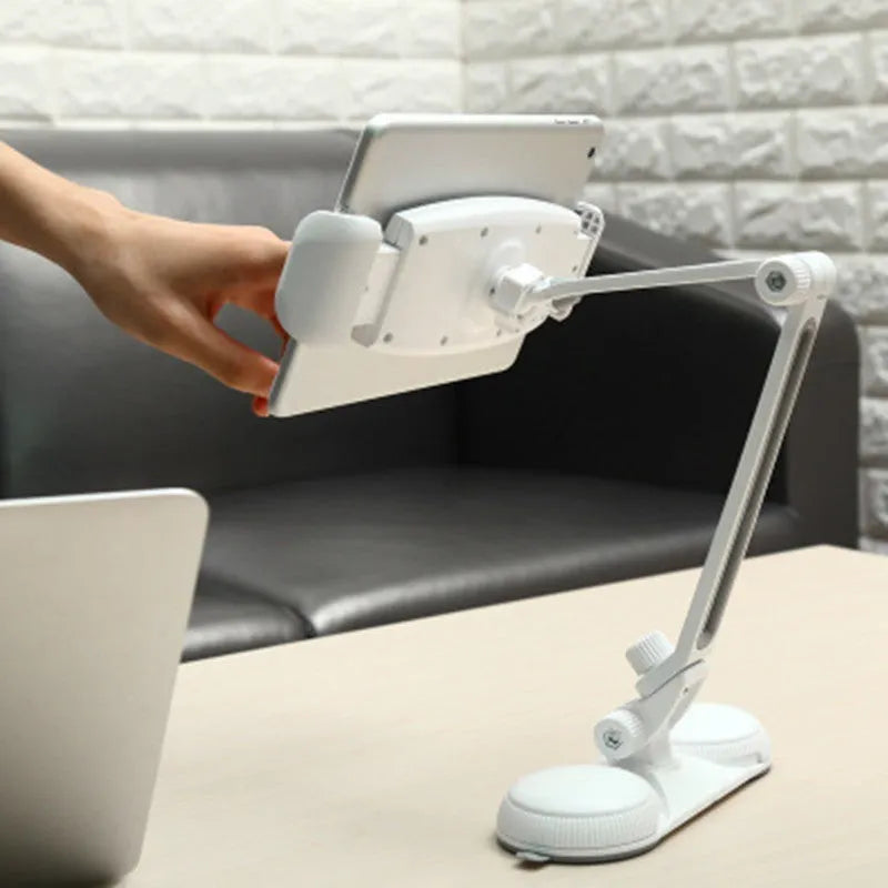 Aluminum alloy sucker bracket with double suction cup holding a tablet on a smooth surface, multi-angle rotation visible