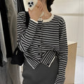 Dark grey and white striped women's slim-fit cardigan coat with long sleeves, shown on a model.